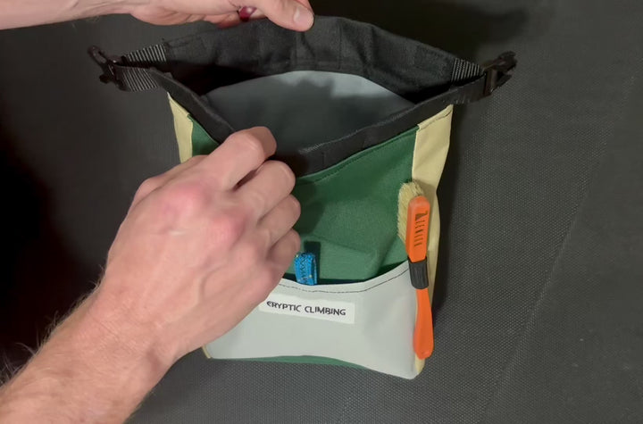 video of how a cryptic climbing chalk bucket works with magnetic closing